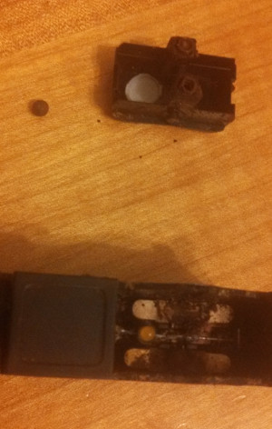 What my switch looks like before cleaning. Notice the rusty ball bearing on the table.